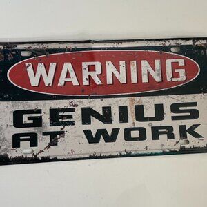 “Warning: Genius at Work” Tin Sign